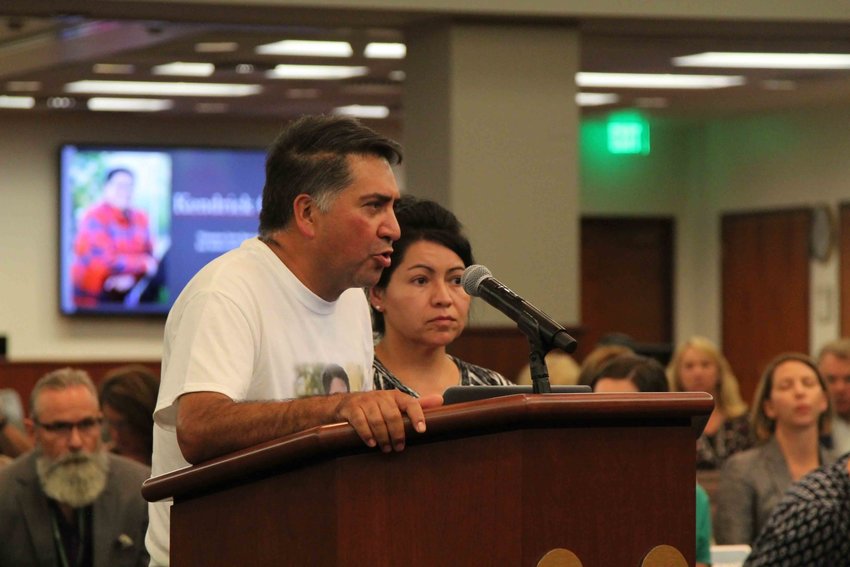John Castillo addresses Douglas County comissioners alongside wife, Maria, about school security. The couple’s son, Kendrick, was killed in the STEM School Highlands Ranch shooting.